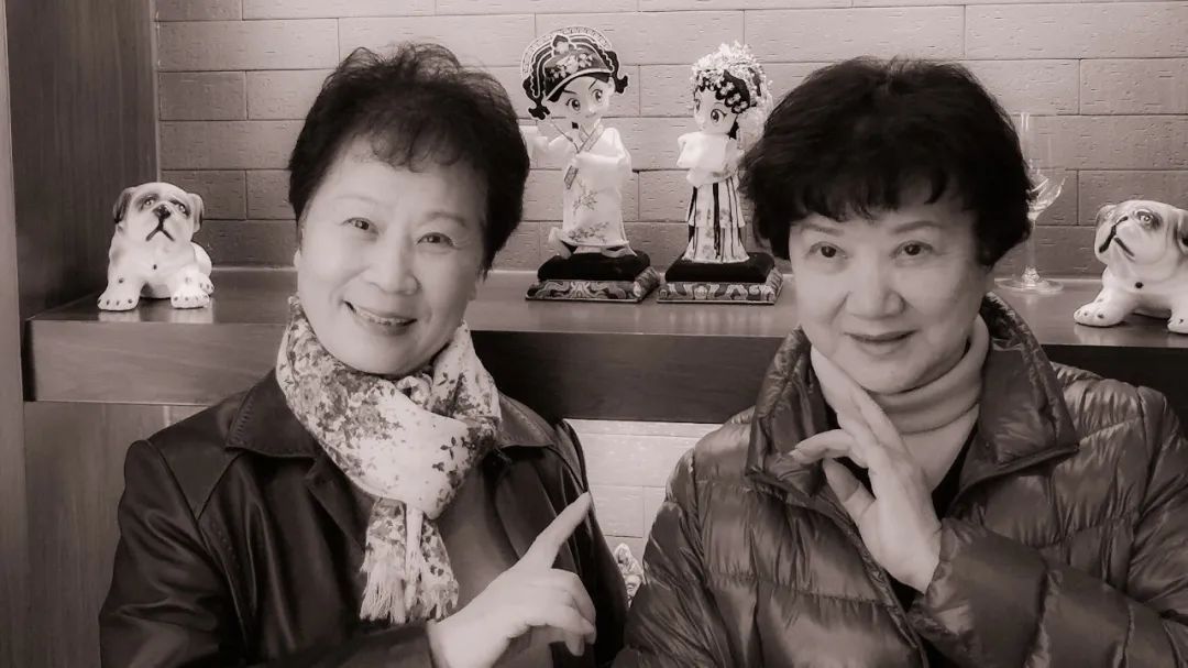 A group photo of the two teachers with their opera puppets