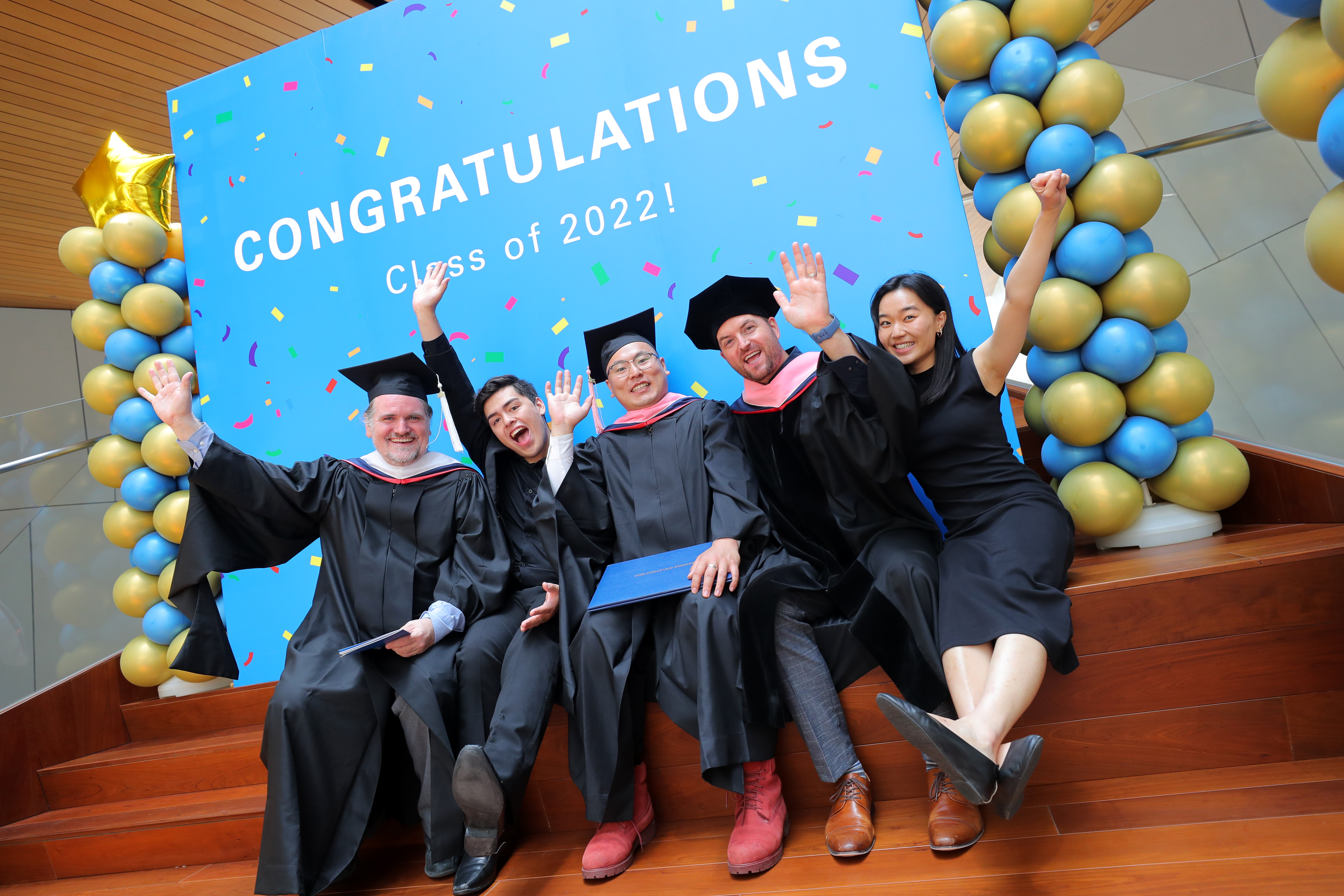 Graduates and teachers taking photo