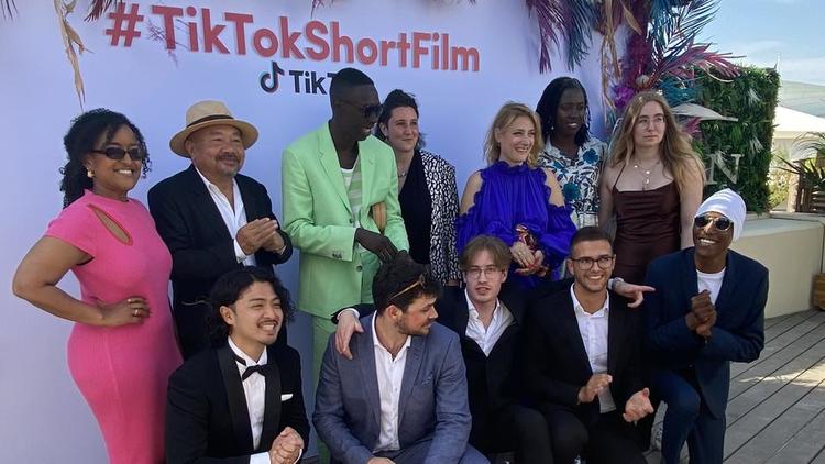 Pan Lide (second from left in the back row) and the winner of the Cannes Douyin Short Film Competition.
