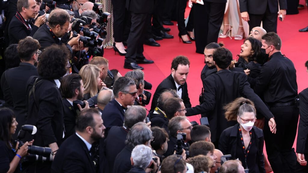 Protesters storm the red carpet for the premiere of "Three Thousand Years of Missing".